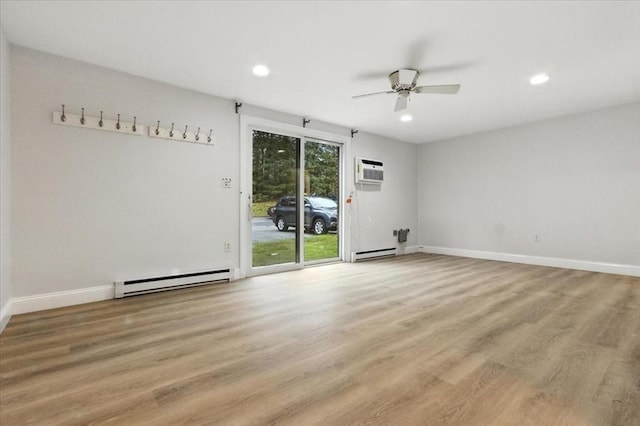 386 Great Rd Unit A3, Acton, MA 01720 - empty room with a baseboard heating unit, a ceiling fan, light wood-type flooring, recessed lighting, and an AC wall unit