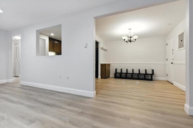 386 Great Rd Unit A3, Acton, MA 01720 - unfurnished room with a chandelier, light wood finished floors, recessed lighting, and electric panel