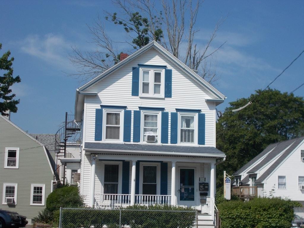 434 Main St, Haverhill, MA 01830 - view of front of house featuring covered porch, stairway, a chimney, and cooling unit