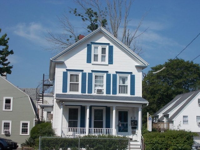 434 Main St, Haverhill, MA 01830 - view of front of house featuring covered porch, stairway, a chimney, and cooling unit