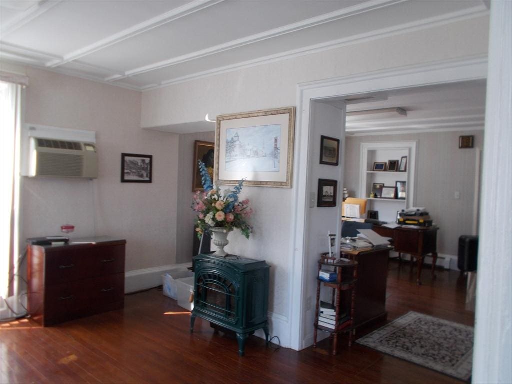 434 Main St, Haverhill, MA 01830 - hall featuring a wall mounted air conditioner, wood finished floors, and an office area