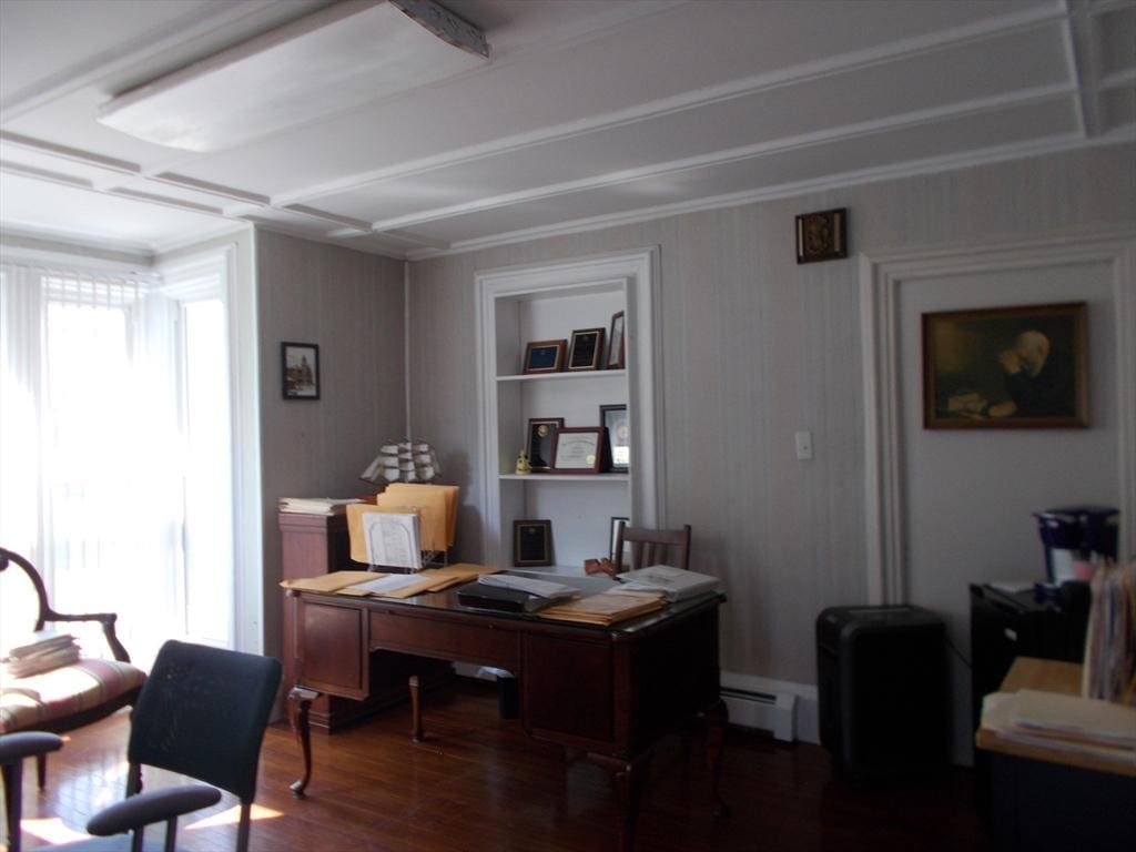 434 Main St, Haverhill, MA 01830 - home office featuring a baseboard heating unit and wood finished floors