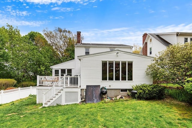 rear view of property with a wooden deck, a chimney, and stairs