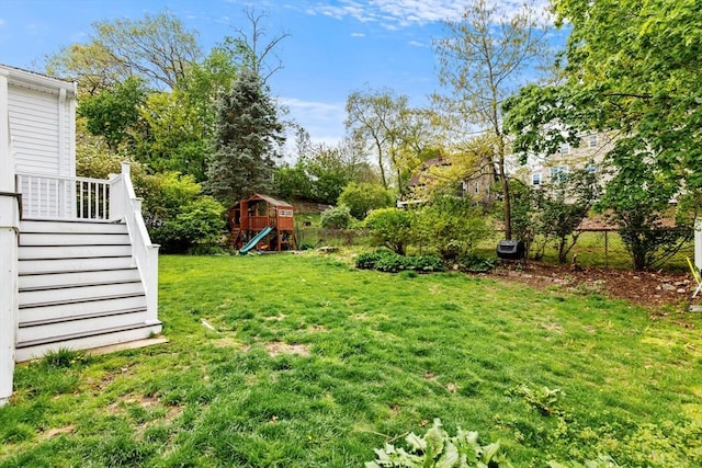 view of yard featuring a playground and stairway