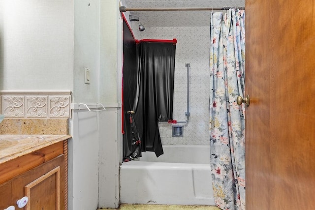 bathroom with shower / tub combo with curtain and vanity