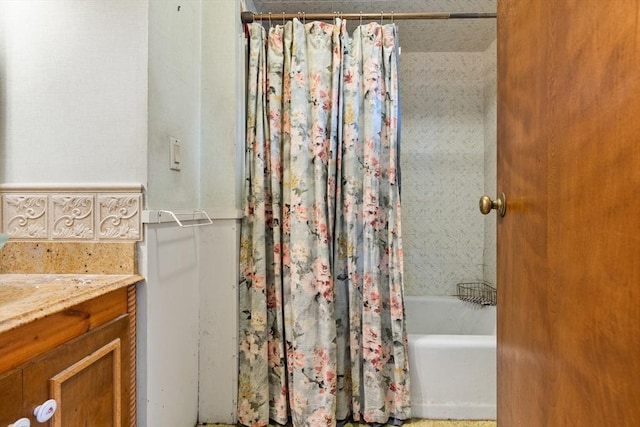 bathroom with shower / bath combination with curtain and vanity