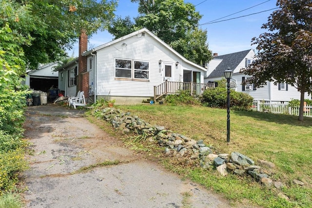 view of front of property with a garage and a front yard