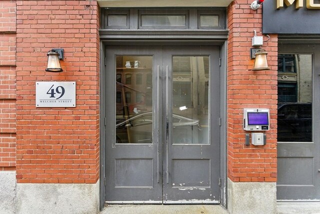 49 Melcher St Unit 405, Boston, MA 02110 - entrance to property featuring french doors and brick siding