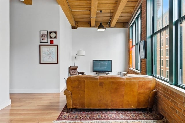 49 Melcher St Unit 405, Boston, MA 02110 - living room featuring wooden ceiling with exposed beams, wood finished floors, and baseboards