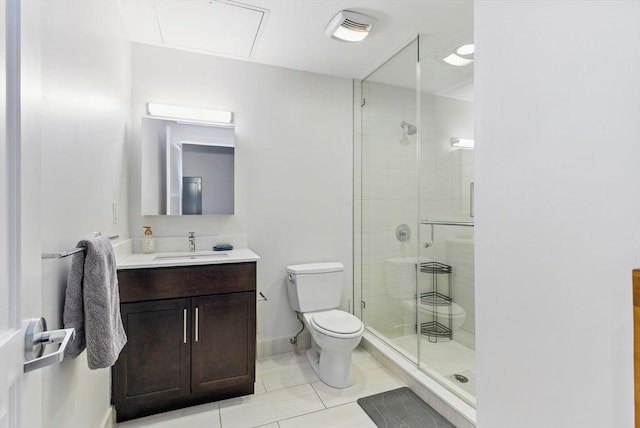 49 Melcher St Unit 405, Boston, MA 02110 - bathroom with toilet, vanity, a shower stall, tile patterned floors, and baseboards