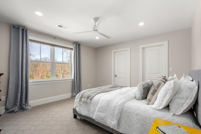 carpeted bedroom with a ceiling fan, recessed lighting, visible vents, and baseboards