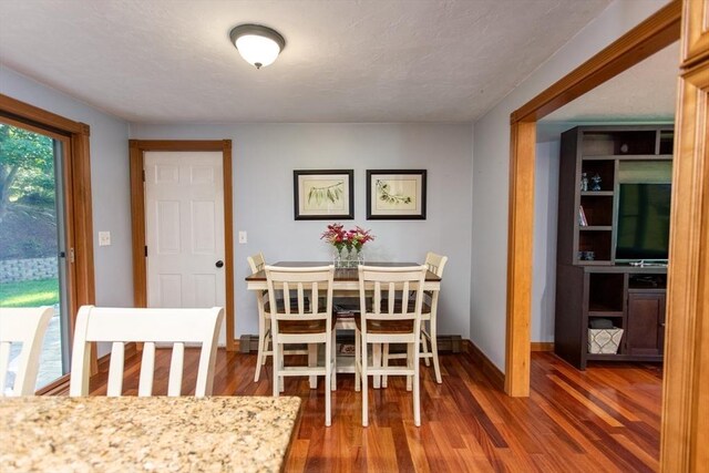 dining room featuring dark hardwood / wood-style floors