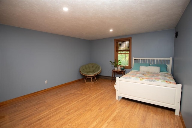 bedroom featuring light hardwood / wood-style flooring and a closet