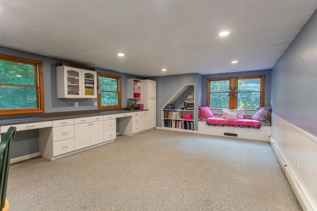 bathroom with a baseboard radiator, toilet, tile patterned floors, and walk in shower