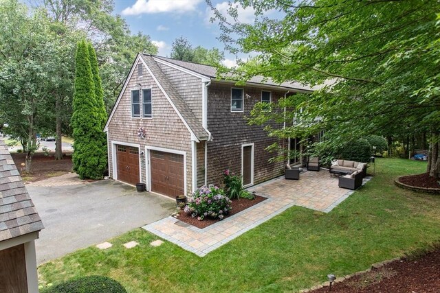 view of property exterior featuring a garage and a shed