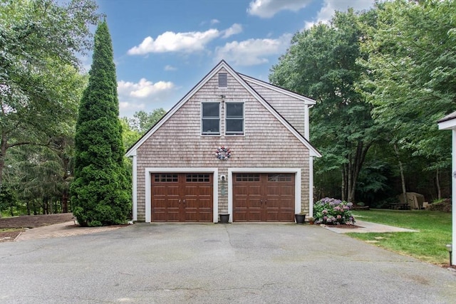 view of home's exterior featuring a patio area, a garage, and a yard