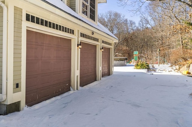 view of snow covered garage