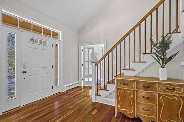 entrance foyer with a baseboard radiator, vaulted ceiling, and dark hardwood / wood-style floors