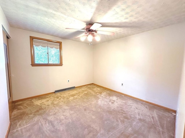333 Clark Rd, Lowell, MA 01852 - unfurnished room with ceiling fan, light colored carpet, baseboards, a textured ceiling, and a baseboard radiator