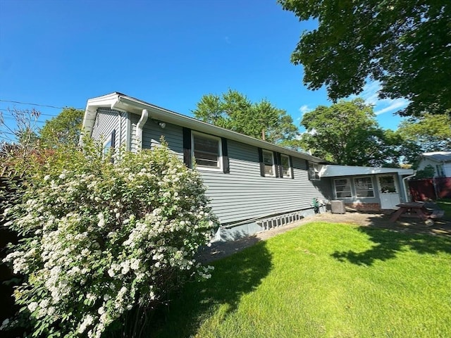 333 Clark Rd, Lowell, MA 01852 - view of side of home with a yard