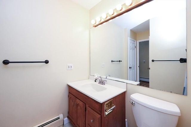 bathroom with vanity, a baseboard radiator, and toilet