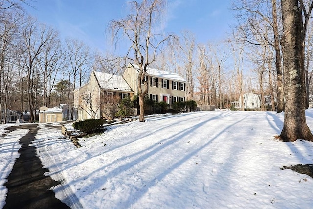 view of front of property with a shed