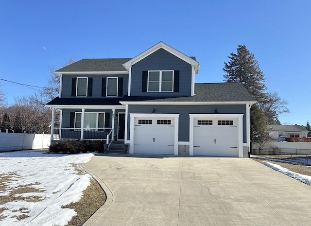 view of front of home with a garage and a porch