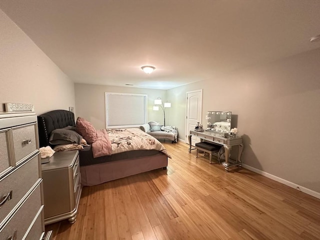 bedroom with light wood-type flooring