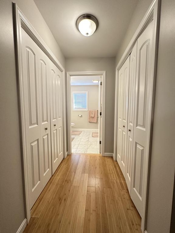 hallway featuring light hardwood / wood-style flooring