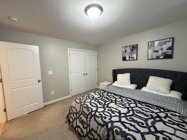 carpeted bedroom with a closet