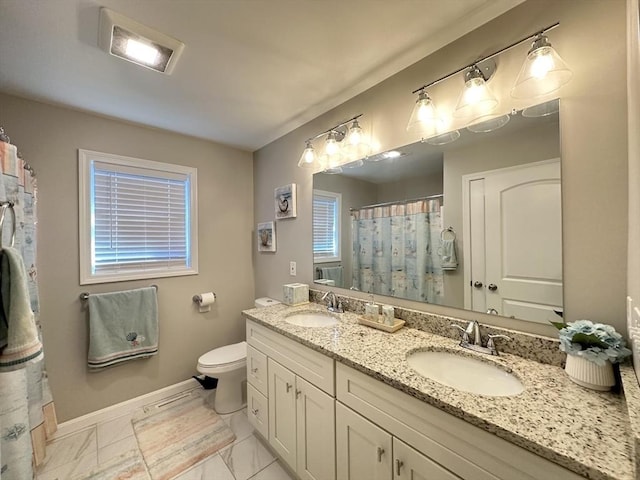 bathroom with vanity and toilet