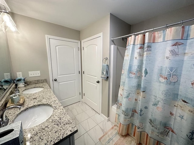 bathroom featuring vanity and shower / bath combo with shower curtain