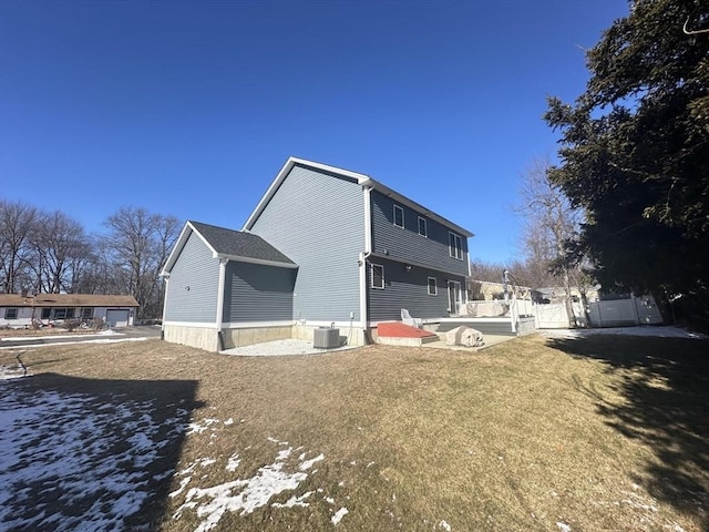 back of property with central AC unit