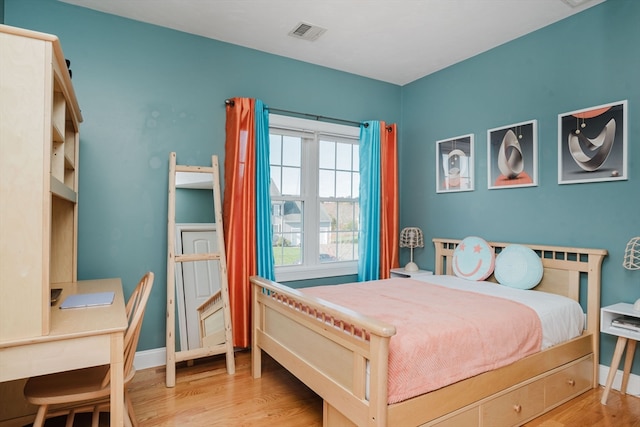 bedroom featuring light wood-type flooring