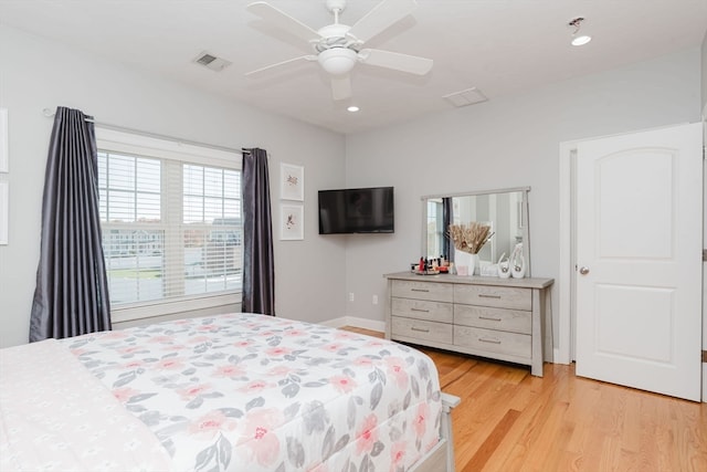 bedroom featuring light wood-type flooring and ceiling fan