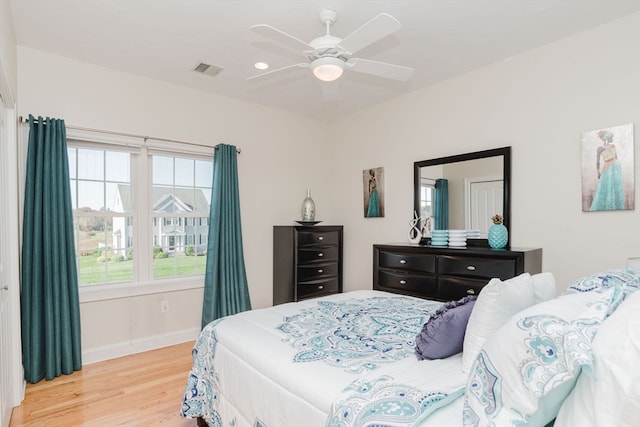 bedroom featuring ceiling fan and light hardwood / wood-style flooring