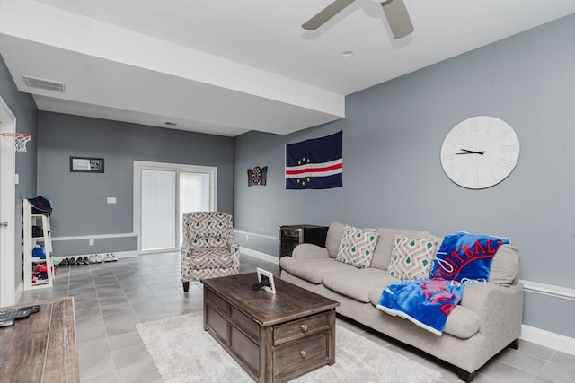 tiled living room featuring ceiling fan