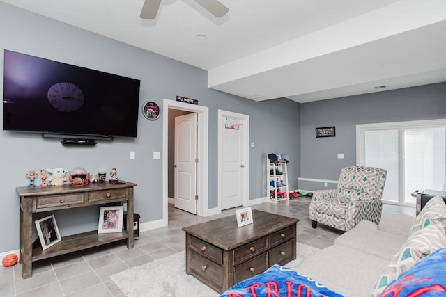 tiled living room with ceiling fan