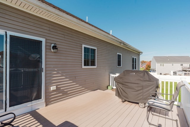 wooden terrace with area for grilling