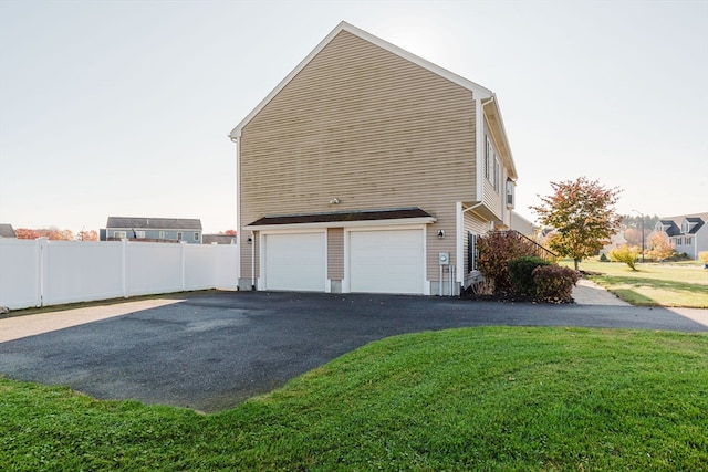 view of side of home with a garage