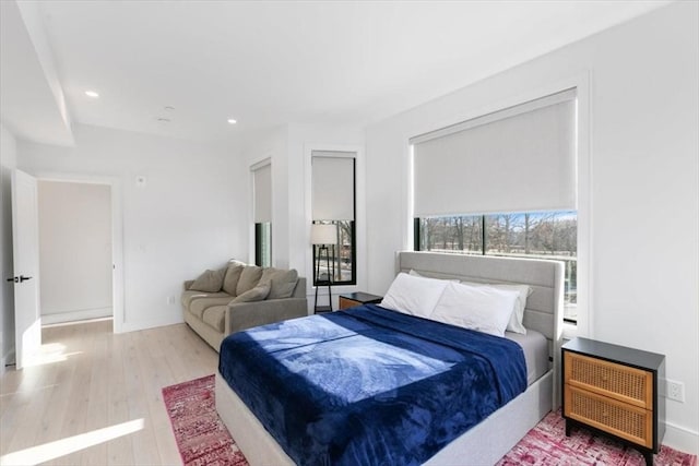 bedroom with hardwood / wood-style floors