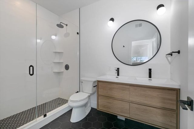 bathroom featuring toilet, vanity, an enclosed shower, and tile patterned floors