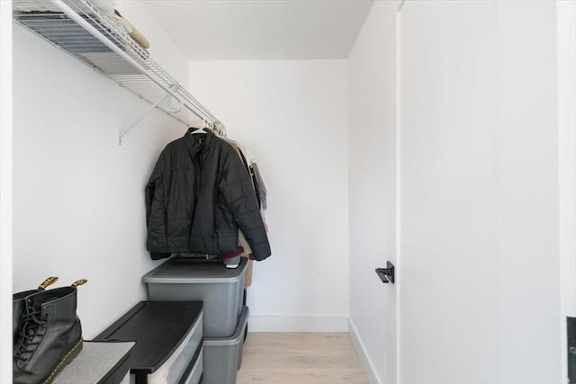 spacious closet with light hardwood / wood-style floors