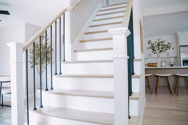 stairs with wood finished floors