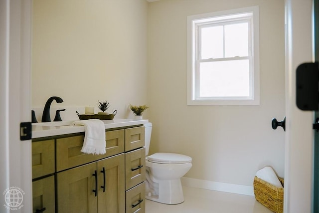 bathroom with toilet and vanity