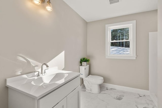77 Minot Ave, Wareham, MA 02571 - bathroom with marble finish floors, toilet, vanity, and baseboards
