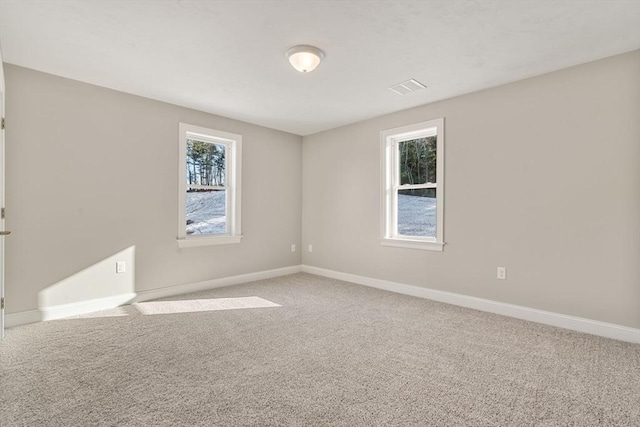 77 Minot Ave, Wareham, MA 02571 - spare room with plenty of natural light, light carpet, and baseboards