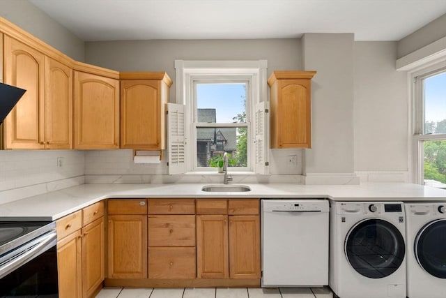 149 Winthrop Rd Unit 5, Brookline, MA 02445 - washroom with washing machine and clothes dryer and light tile patterned flooring