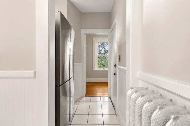 149 Winthrop Rd Unit 5, Brookline, MA 02445 - hall with a wainscoted wall and light tile patterned flooring