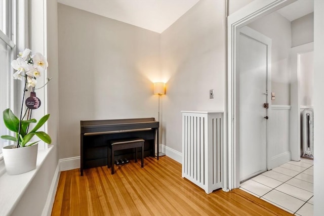 149 Winthrop Rd Unit 5, Brookline, MA 02445 - living area featuring radiator heating unit and light wood-type flooring